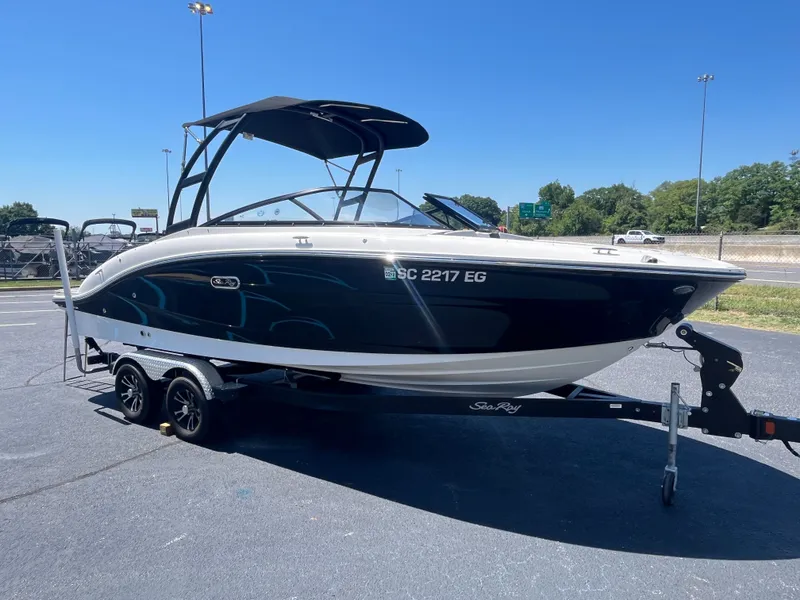 Slide: The Image of 2024 Sea Ray 21 SPX boat on trailer, sunny day. - 7