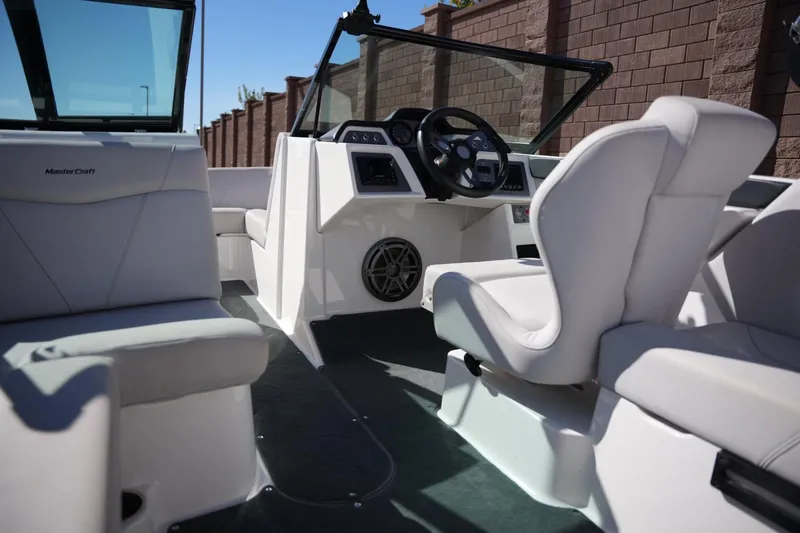 Slide: The Image of 2020 MasterCraft NXT20 boat interior with modern seating and steering console. - 15