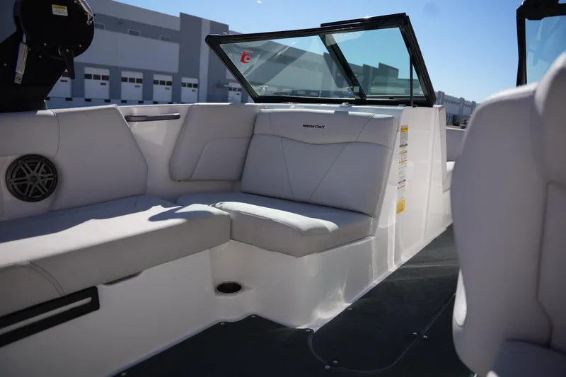 Slide: The Image of 2020 MasterCraft NXT20 boat interior with white seating and modern design. - 16