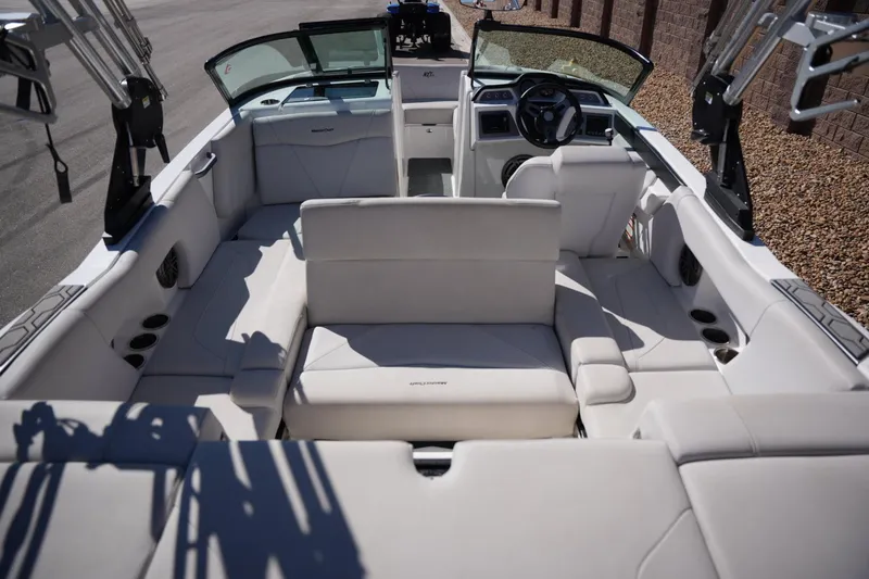 Slide: The Image of 2020 MasterCraft NXT20 boat interior with white seating and modern dashboard. - 17