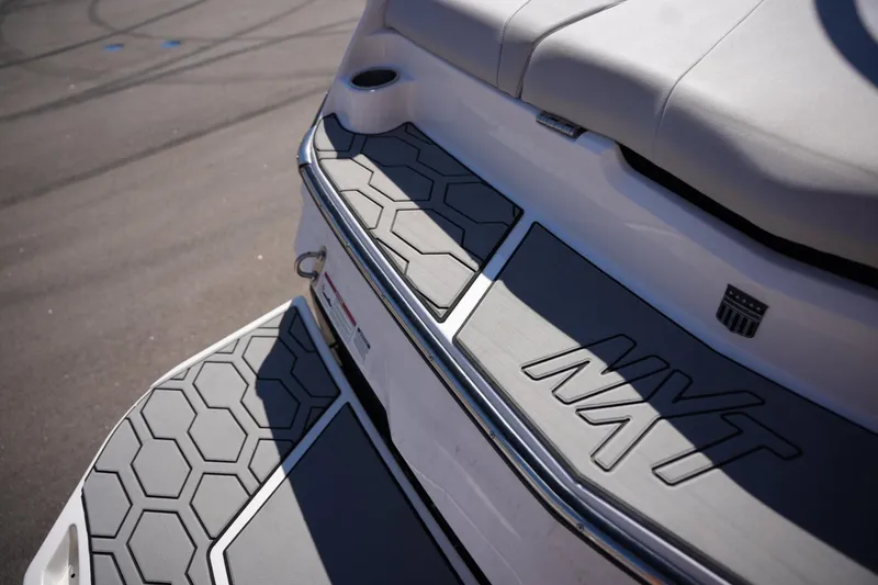 Slide: The Image of 2020 MasterCraft NXT20 boat with hexagonal deck pattern and sleek design. - 21