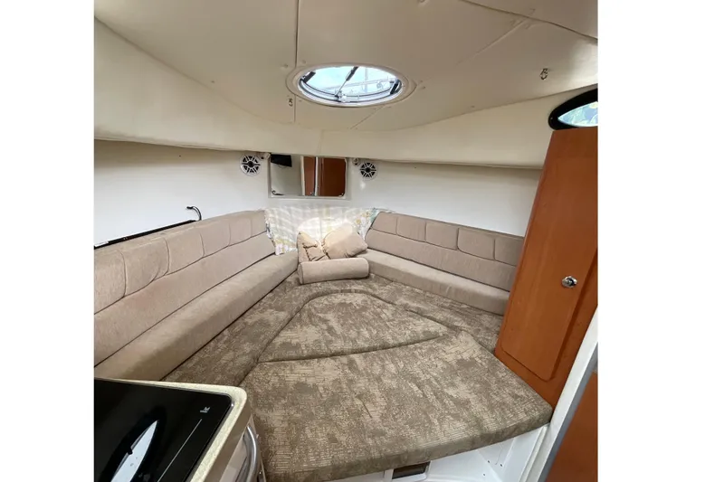 Slide: The Image of Interior cabin of 2005 Seaswirl Striper 2901 Walkaround O/B with beige seating and skylight. - 15
