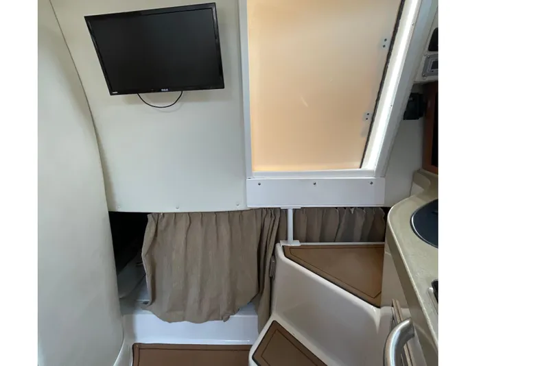 Slide: The Image of Interior of 2005 Seaswirl Striper 2901 Walkaround O/B with TV and compact design. - 16