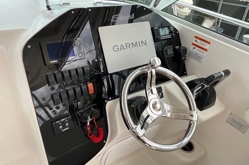 Slide: The Image of 2005 Seaswirl Striper 2901 Walkaround O/B helm with Garmin navigation system. - 4