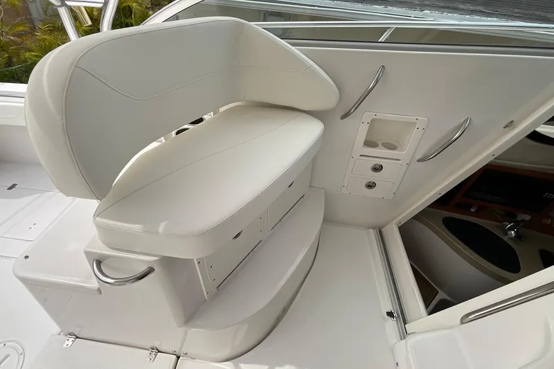 Slide: The Image of 2005 Seaswirl Striper 2901 Walkaround O/B boat interior with white seating and storage compartments. - 6