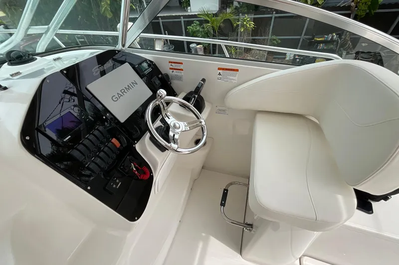 Slide: The Image of 2005 Seaswirl Striper 2901 Walkaround O/B helm with Garmin navigation system. - 9