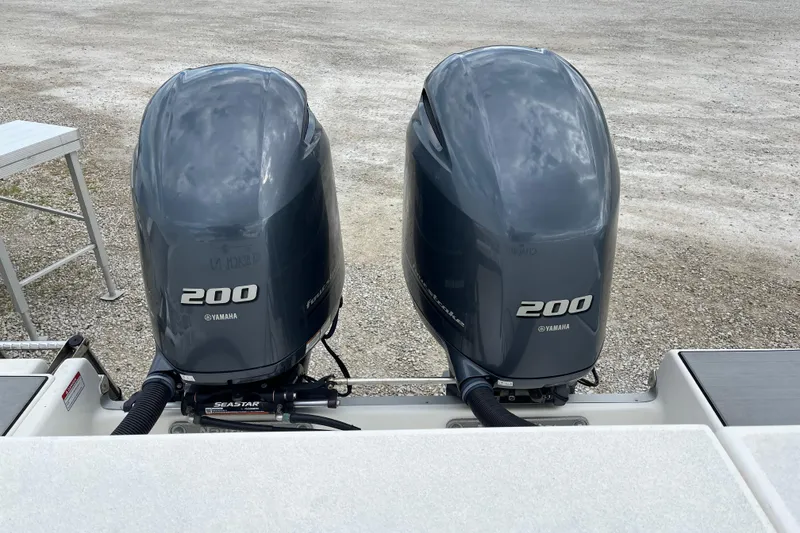 Slide: The Image of Twin Yamaha 200 outboard engines on a 2022 NauticStar 28 XS boat. - 12