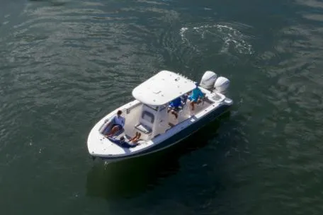 Slide: The Image of Manufacturer Provided Image: 2022 NauticStar 28 XS boat cruising on open water. - 13