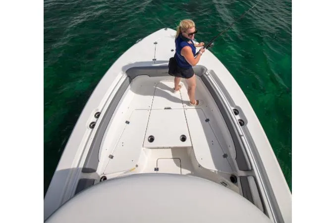 Slide: The Image of Manufacturer Provided Image: 2022 NauticStar 28 XS boat with person fishing on deck. - 14
