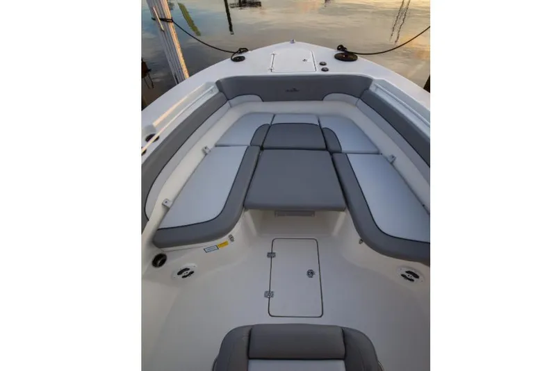 Slide: The Image of Manufacturer Provided Image: 2022 NauticStar 28 XS boat interior with cushioned seating and storage compartments. - 15