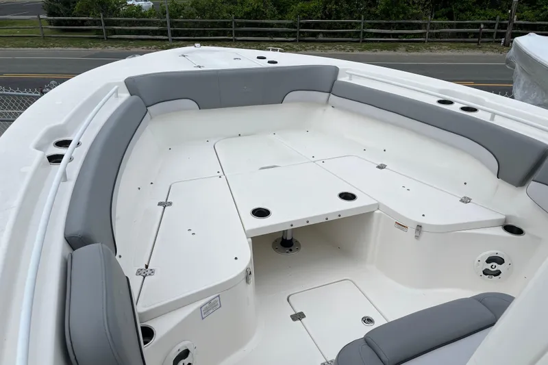 Slide: The Image of 2022 NauticStar 28 XS boat interior with spacious seating and storage compartments. - 5