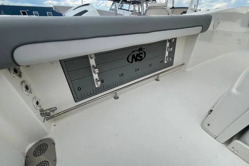 Slide: The Image of 2022 NauticStar 28 XS boat interior with measurement scale and seating. - 9