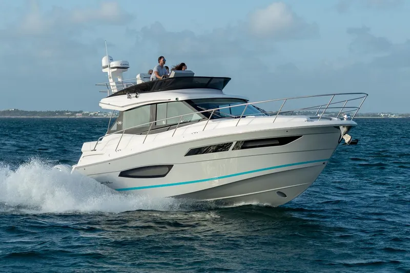 The Image of Manufacturer Provided Image: 2026 Regal 38 FXO yacht cruising on open water under a clear sky. - 0