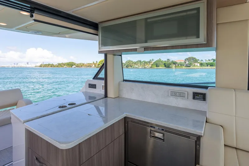 Slide: The Image of Manufacturer Provided Image: Modern interior of 2026 Regal 38 XO yacht with sleek kitchen and ocean view. - 11