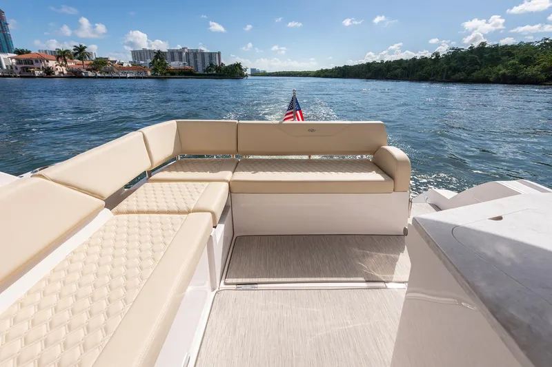 Slide: The Image of Manufacturer Provided Image: 2026 Regal 38 XO yacht with beige seating, cruising on a sunny day. - 6