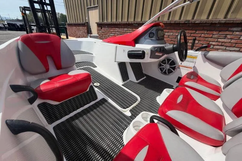 Slide: The Image of 2008 Sea-Doo 150 Speedster interior with red and gray seating, steering wheel, and dashboard. - 10