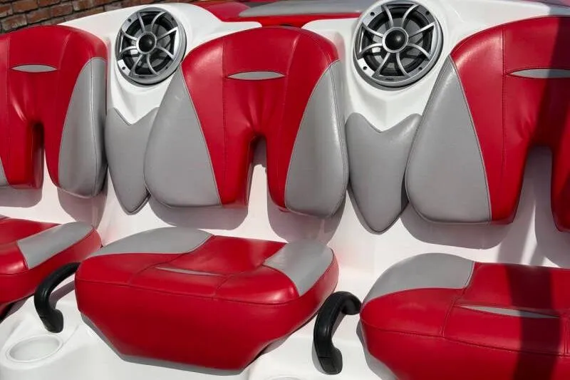 Slide: The Image of Red and gray seats of a 2008 Sea-Doo 150 Speedster boat with speakers. - 8