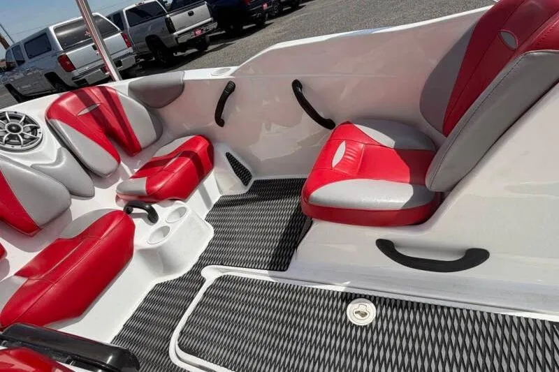 Slide: The Image of 2008 Sea-Doo 150 Speedster interior with red and white seating, black accents. - 9