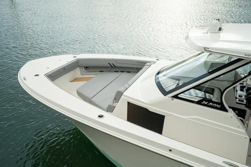 Slide: The Image of Manufacturer Provided Image: 2026 Regal 34 SAV boat with sleek design and spacious seating on calm water. - 3