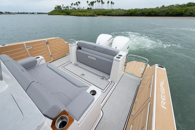 Slide: The Image of Manufacturer Provided Image: 2026 Regal 34 SAV boat with spacious deck and dual engines on water. - 9