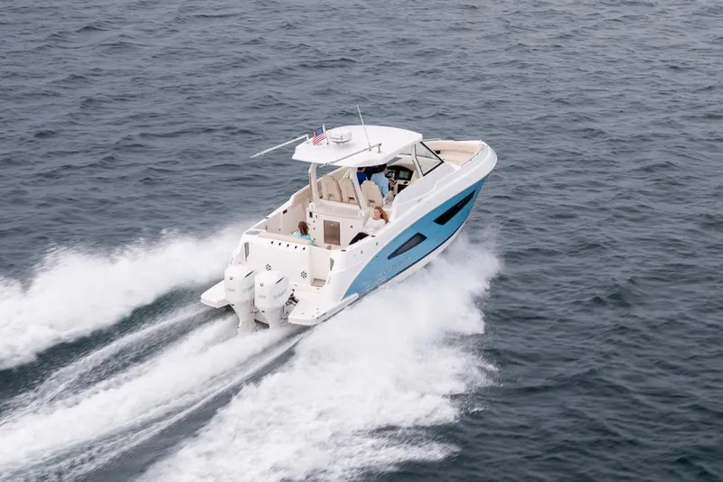 The Image of Manufacturer Provided Image: 2026 Regal 33 SAV boat cruising on open water, showcasing sleek design and powerful engines. - 0