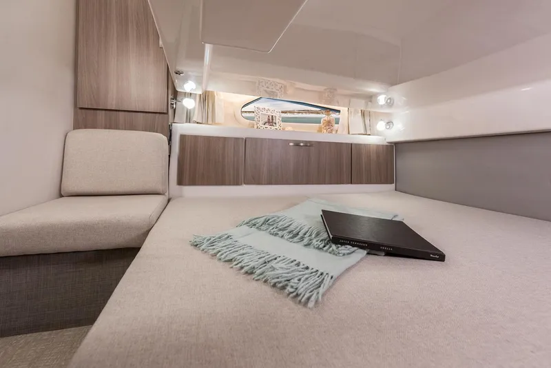 Slide: The Image of Manufacturer Provided Image: Luxurious interior of 2026 Regal 33 SAV boat with cozy bed and modern decor. - 11