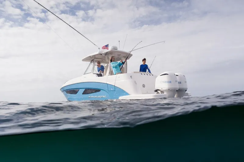 Slide: The Image of Manufacturer Provided Image: 2026 Regal 33 SAV boat on open water, people fishing, overcast sky. - 2
