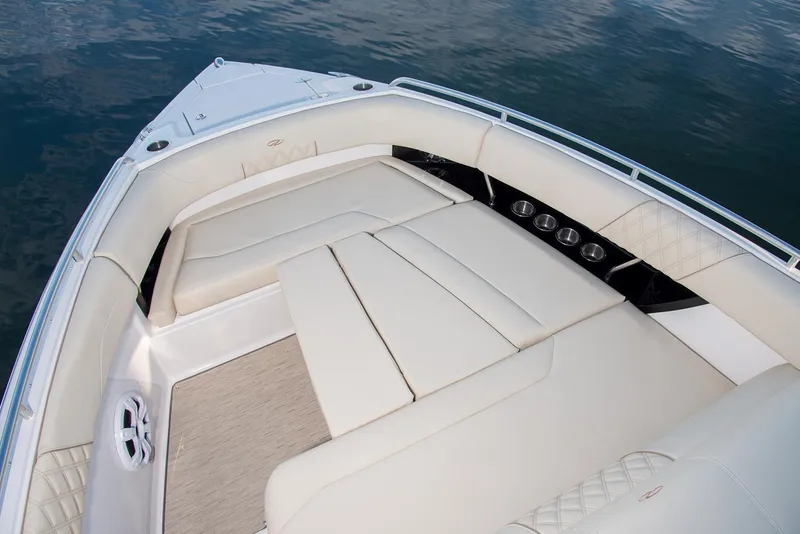 Slide: The Image of Manufacturer Provided Image: 2026 Regal 33 SAV boat interior with luxurious seating on calm water. - 6