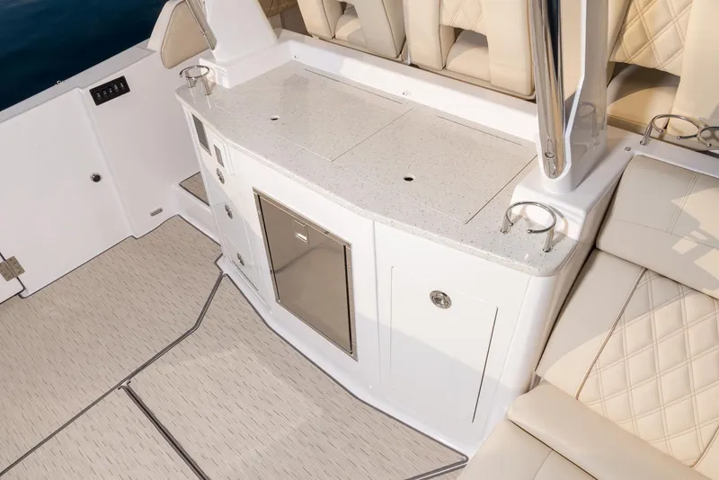 Slide: The Image of Manufacturer Provided Image: 2026 Regal 33 SAV boat interior with sleek seating and modern amenities. - 8