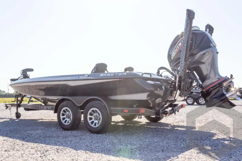 Slide: The Image of 2026 Skeeter ZXE20 boat on trailer, featuring sleek design and powerful outboard motor. - 11