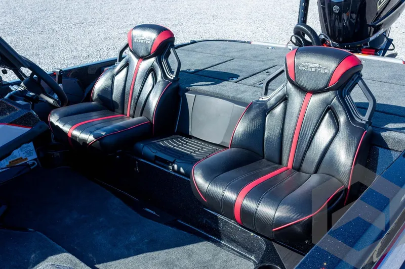 Slide: The Image of 2026 Skeeter ZXE20 boat interior with black and red seats, steering wheel visible. - 15