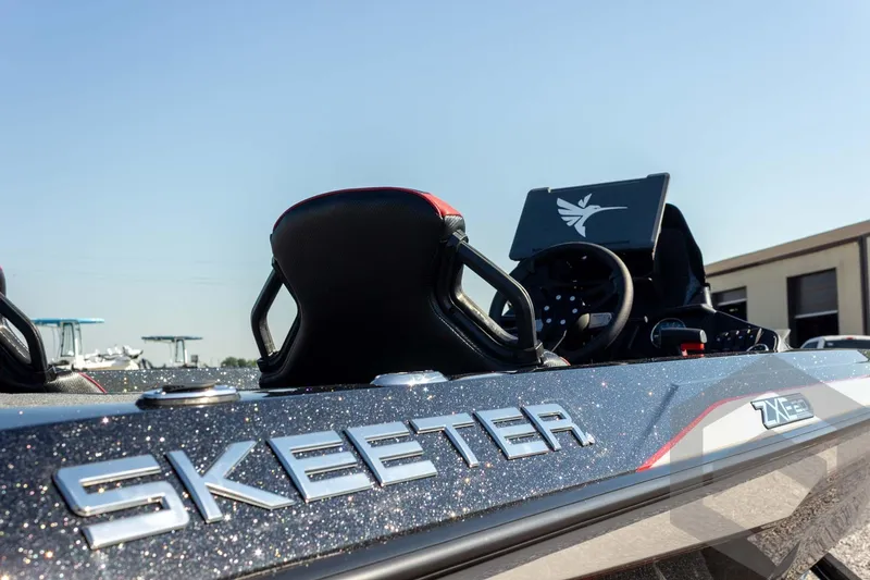 Slide: The Image of 2026 Skeeter ZXE20 boat with sleek design and modern dashboard. - 28