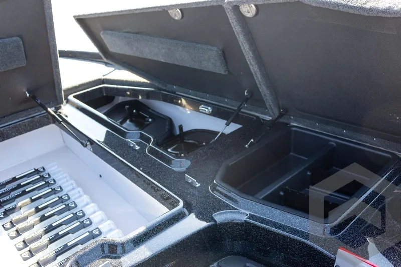 Slide: The Image of Open storage compartments in a 2026 Skeeter ZXE20 boat. - 34