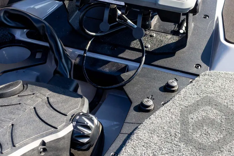 Slide: The Image of Control panel of 2026 Skeeter ZXE20 boat with foot pedal and switches. - 38