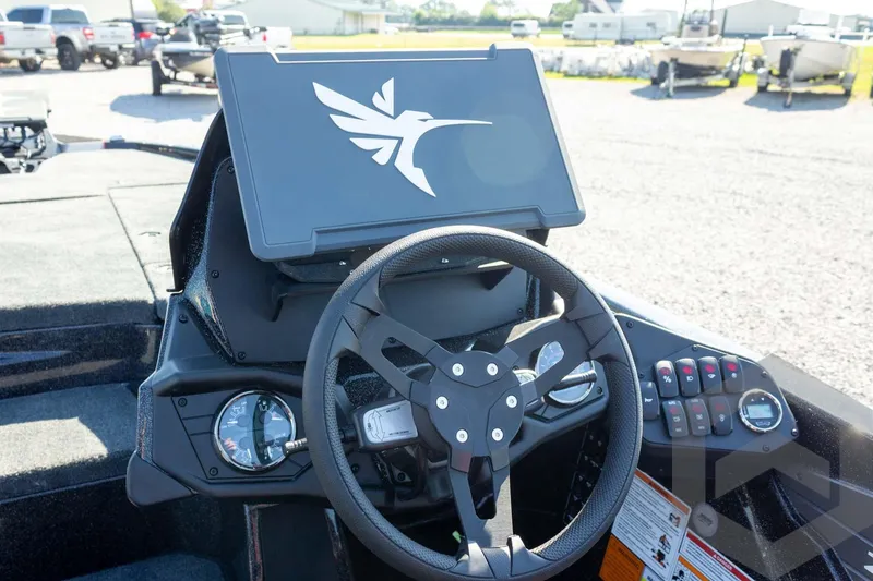 Slide: The Image of Steering console of 2026 Skeeter ZXE20 boat with digital display and controls. - 43