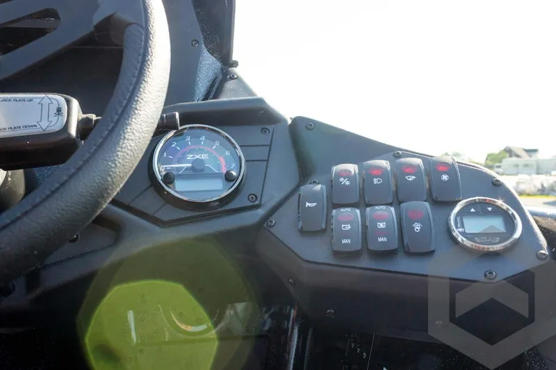 Slide: The Image of Dashboard of 2026 Skeeter ZXE20 with control switches and gauges. - 45