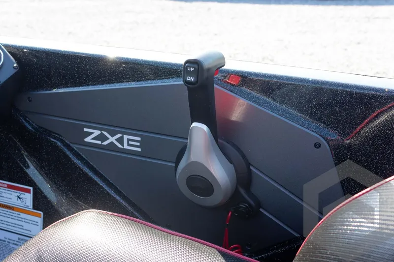 Slide: The Image of Control lever of 2026 Skeeter ZXE20 boat, featuring sleek design and "UP" and "DN" buttons. - 47