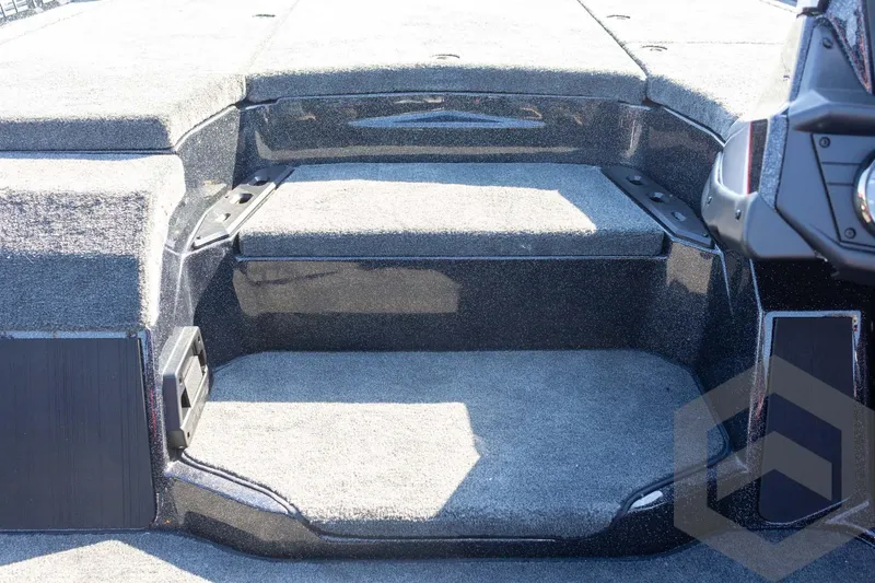 Slide: The Image of Interior view of 2026 Skeeter ZXE20 boat, featuring carpeted steps and sleek design. - 48