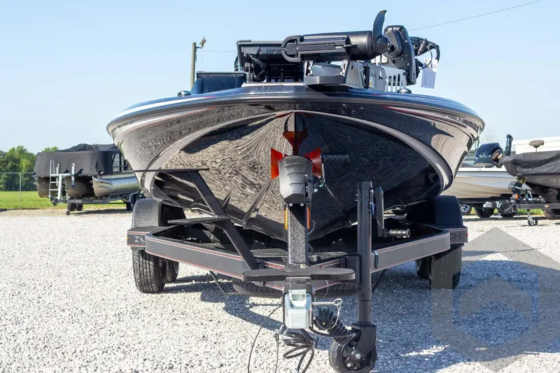 Slide: The Image of 2026 Skeeter ZXE20 boat on trailer, front view, parked on gravel. - 5