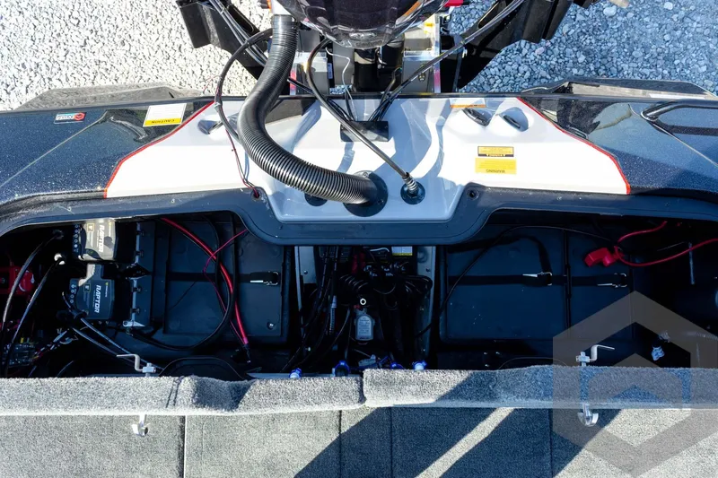 Slide: The Image of 2026 Skeeter ZXE20 boat engine compartment with wiring and components visible. - 56