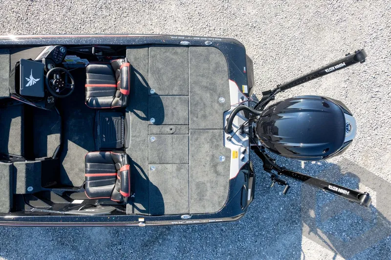 Slide: The Image of Overhead view of 2026 Skeeter ZXE20 boat with dual seats and motor on gravel. - 59