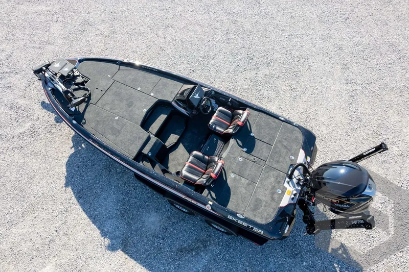 Slide: The Image of 2026 Skeeter ZXE20 fishing boat with dual seats and motor, viewed from above. - 62