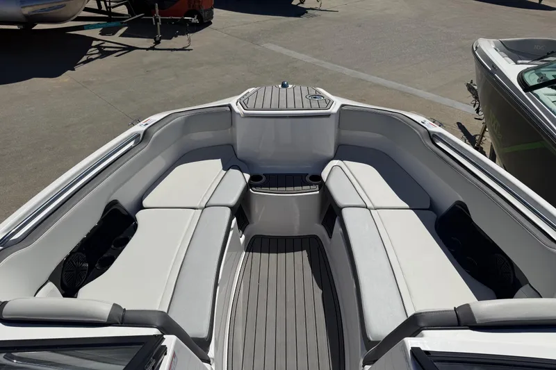 Slide: The Image of 2023 Yamaha Boats AR250 interior with spacious seating and modern design. - 10