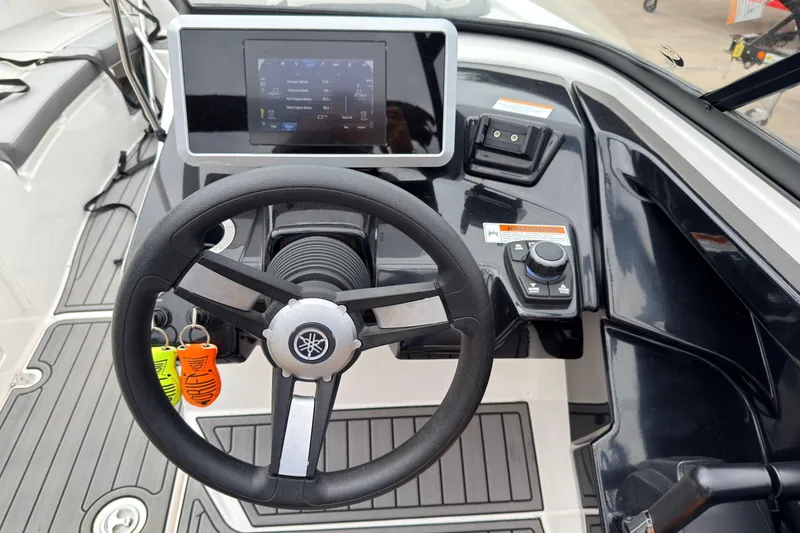 Slide: The Image of Steering console of 2023 Yamaha Boats AR250 with touchscreen display and controls. - 16