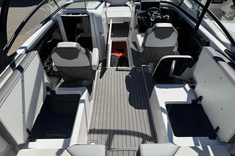 Slide: The Image of 2023 Yamaha Boats AR250 interior with seating and steering console. - 33