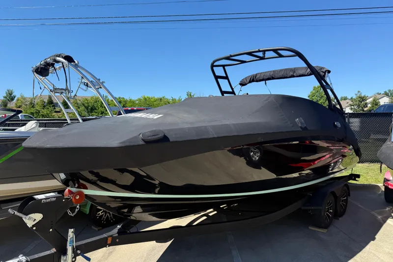 Slide: The Image of 2023 Yamaha Boats AR250 covered, parked on trailer, sunny day. - 4