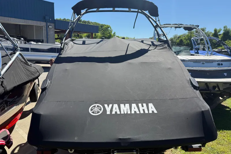Slide: The Image of 2023 Yamaha AR250 boat with cover in outdoor storage area. - 6