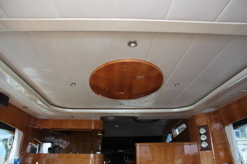 Slide: The Image of Luxurious interior ceiling of a 1999 Horizon 70 Motor Yacht with wood accents. - 38
