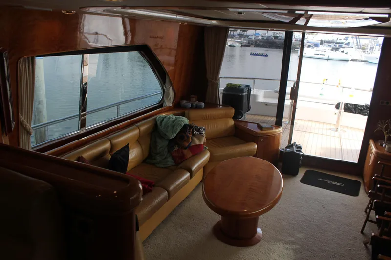 Slide: The Image of Luxurious interior of a 1999 Horizon 70 Motor Yacht with marina view. - 42