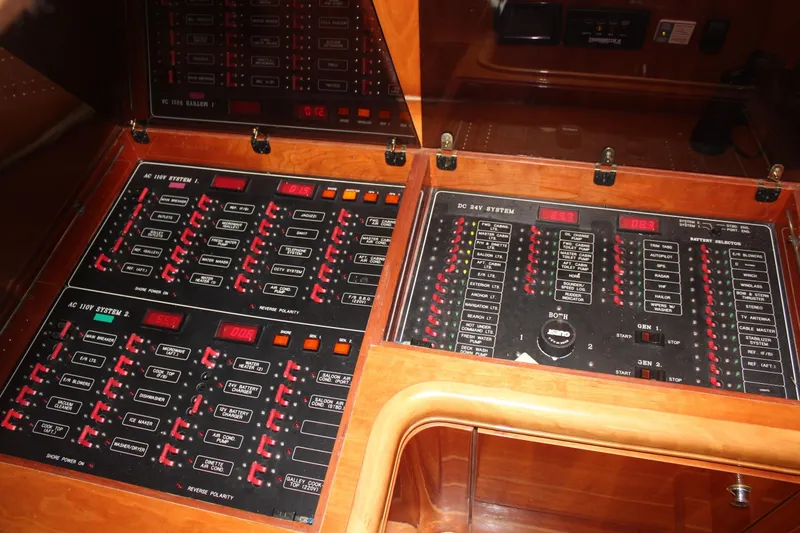 Slide: The Image of Control panel of a 1999 Horizon 70 Motor Yacht, featuring AC and DC systems. - 45